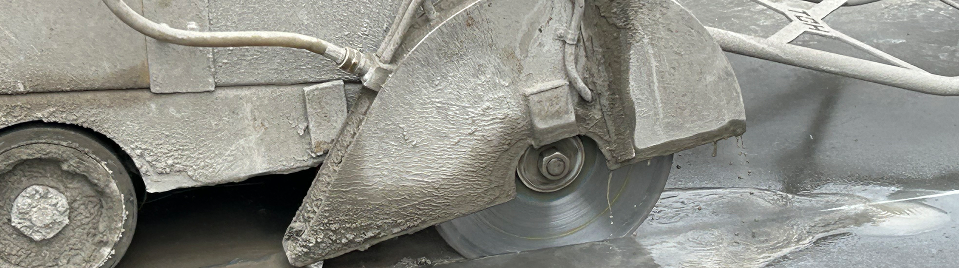 Concrete saw blade cutting through concrete