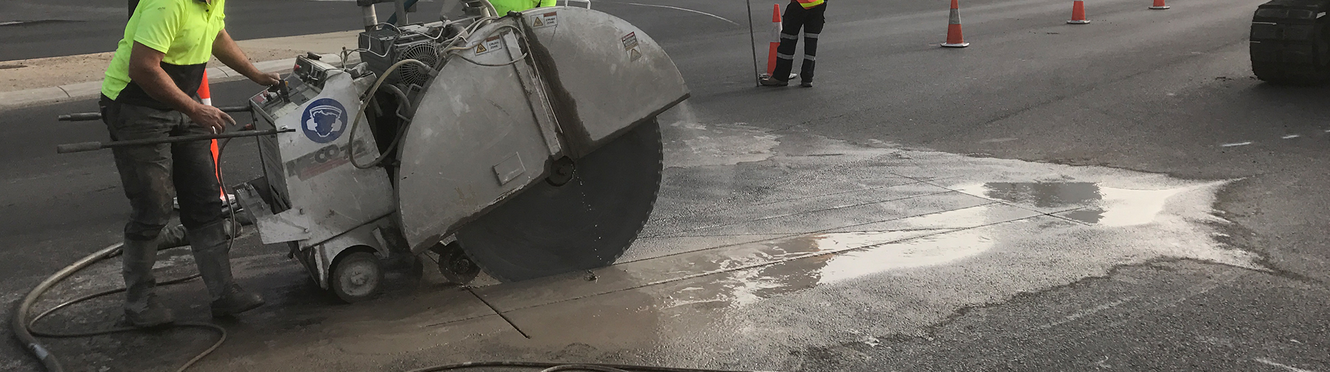 Wet road sawing for concrete slurry removal and cleanup
